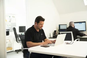 Tim Fairchild sat at a desk