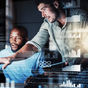 Two men are stood looking at a computer. There is an effect to show code in the background of the image and they are carrying out penetration testing